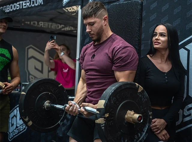An athlete during a&nbsp;heavy deadlift attempt with a&nbsp;thick bar and weight